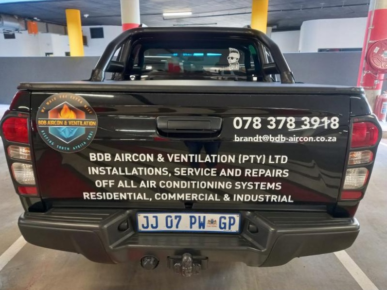 The branded BDB Aircon & Ventilation bakkie with contact details on the back
