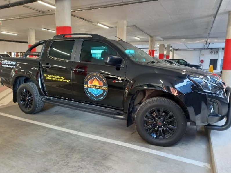 The branded BDB Aircon & Ventilation bakkie parked on site