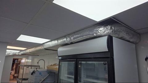 Insulated ducting above a commercial kitchen