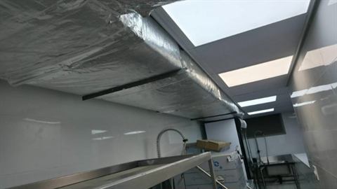 Insulated ducting above a commercial kitchen