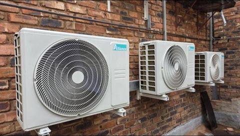 Outdoor condensers on a face-brick wall