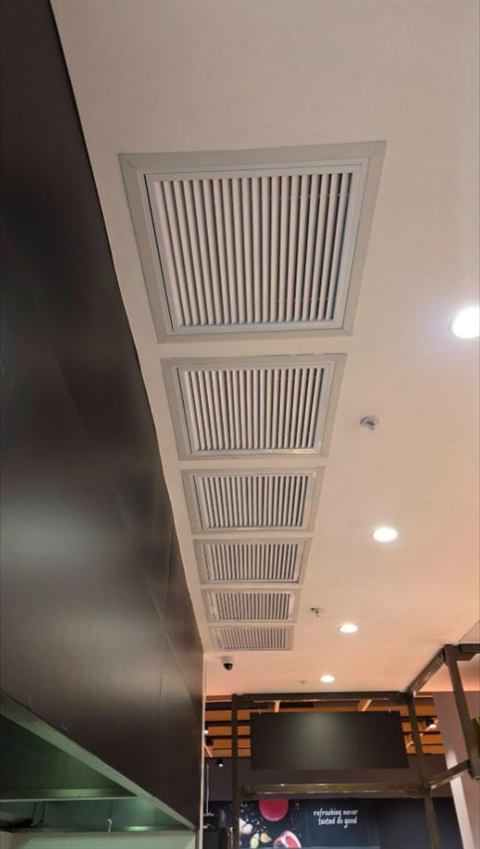 Linear supply air grilles in a ceiling bulkhead