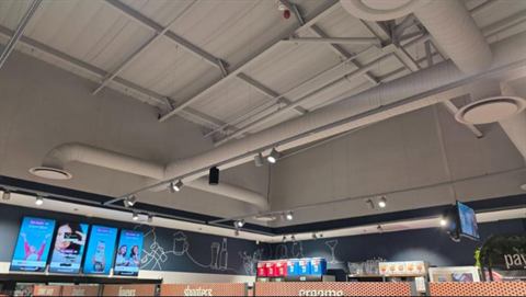 Retail store ceiling with exposed ducting and diffusers