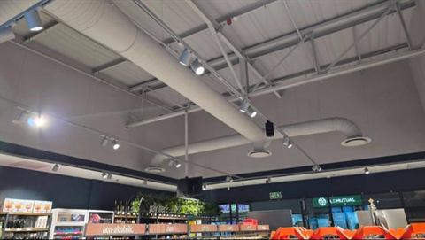 Retail store ceiling with exposed ducting and diffusers
