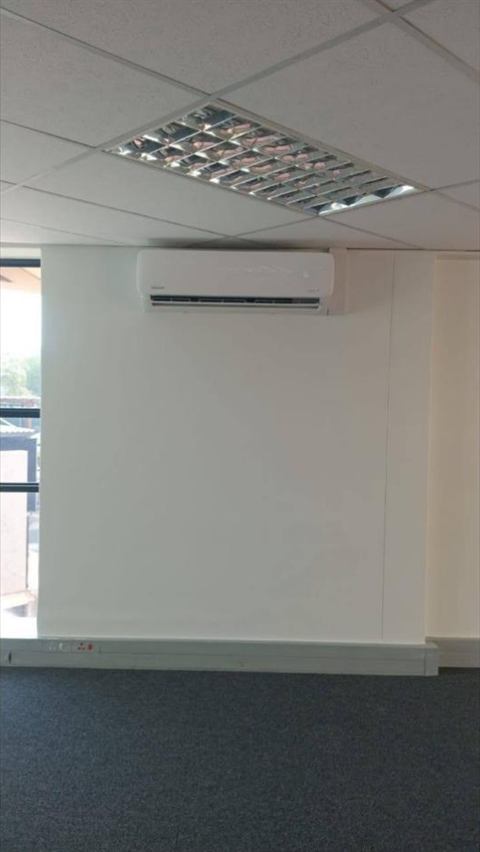 Wall-mounted split unit in an office