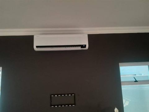 Wall-mounted split unit in a boardroom