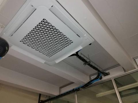 Cassette unit in an exposed office ceiling
