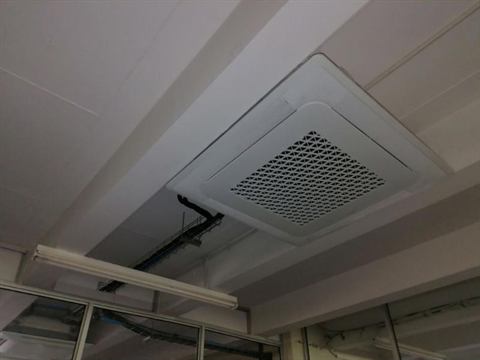 Cassette unit in an exposed office ceiling
