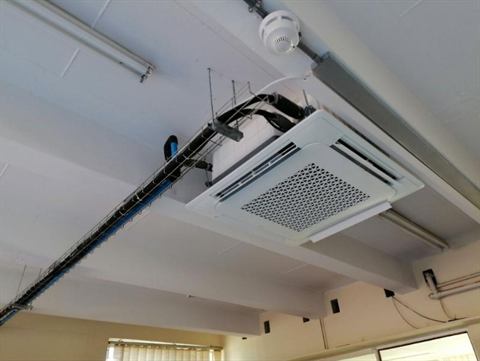 Cassette unit in an exposed office ceiling