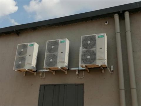 Bank of outdoor condensers on brackets