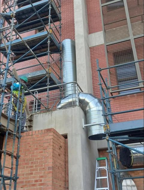 Ducting going up a multi-storey building under construction