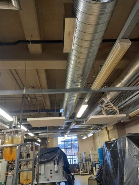 Spiral ducting in a workshop ceiling