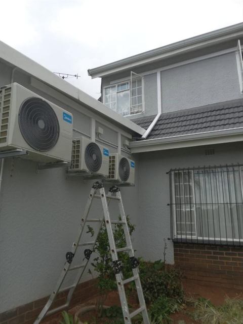Outdoor units installed at a double-storey home