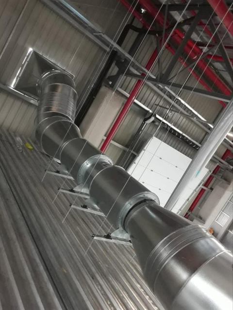 Spiral ducting in an industrial roof